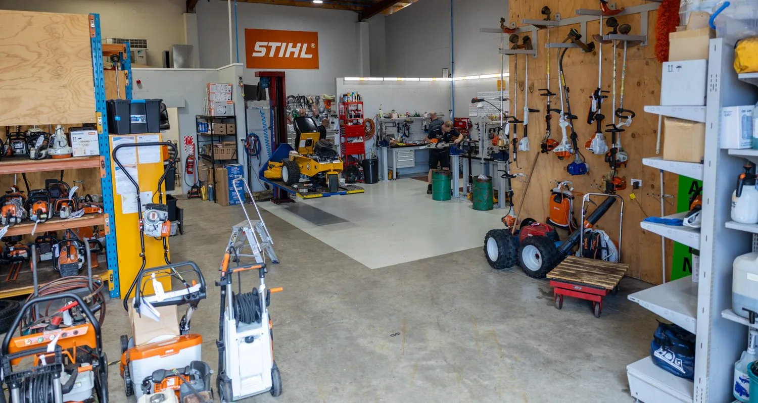 The service workshop at STIHL SHOP Mt Maunganui with machines waiting on the floor
