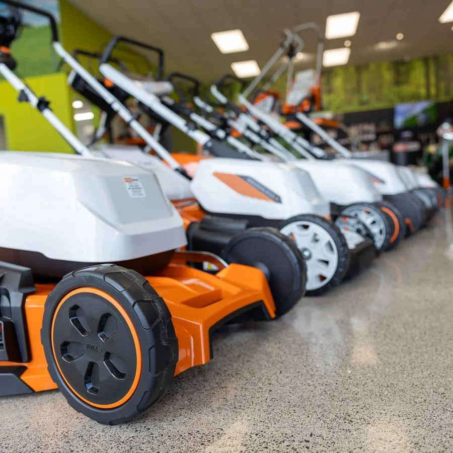 A row of STIHL lawnmowers in the showroom
