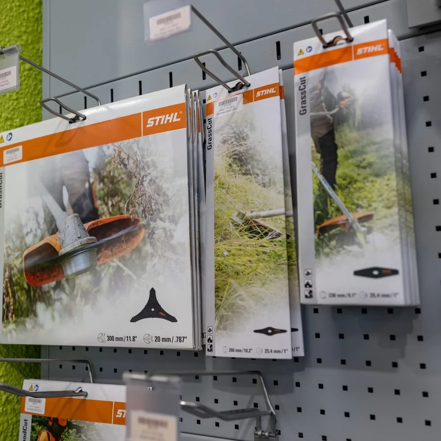 Accessories displayed on the showroom wall at STIHL SHOP Mt Maunganui