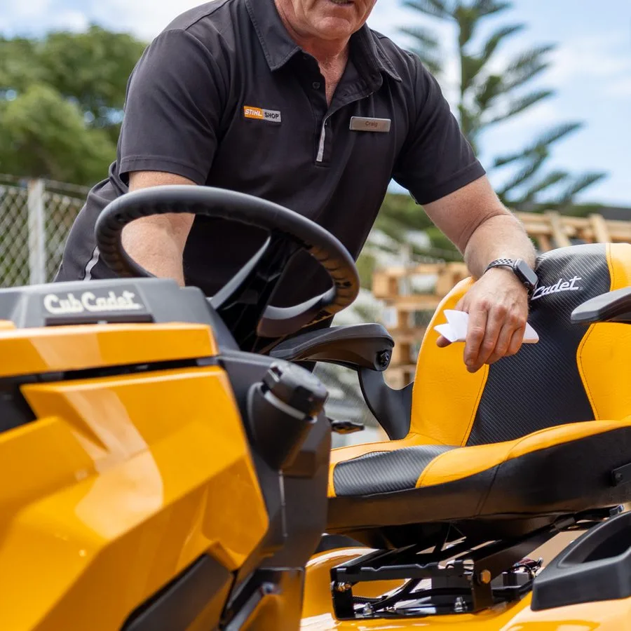 A Cub Cadet ride-on mower being demonstrated outside the store