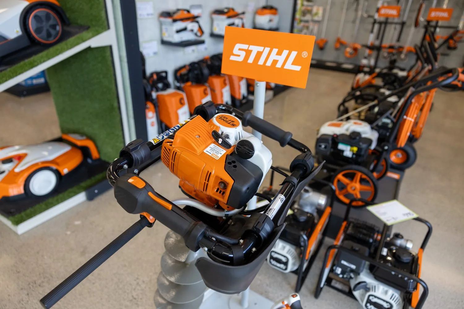 STIHL chainsaws and an earth auger on display in the showroom