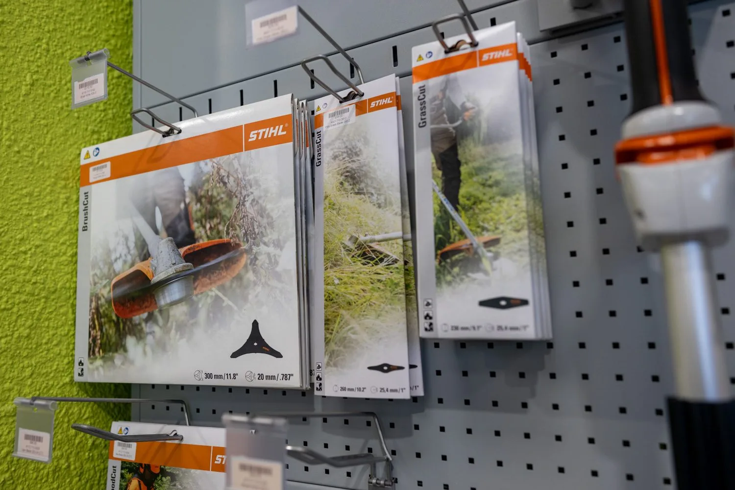 Accessories displayed on the showroom wall at STIHL SHOP Mt Maunganui