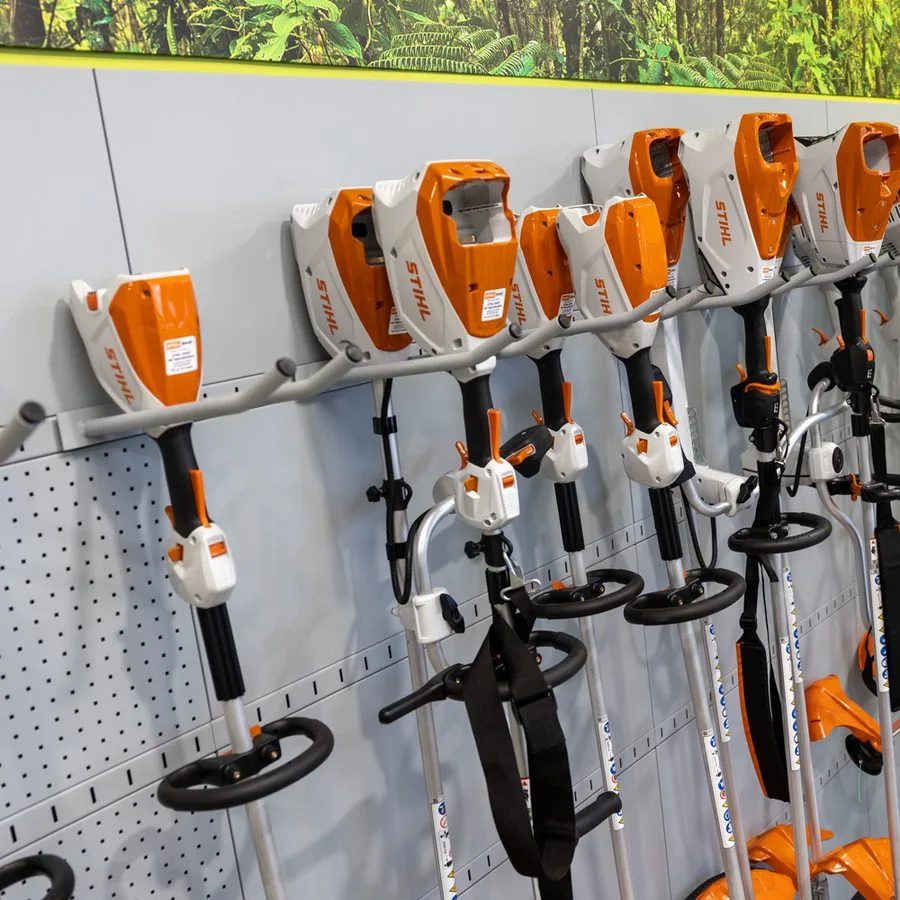 STIHL shaft tools displayed on the showroom wall