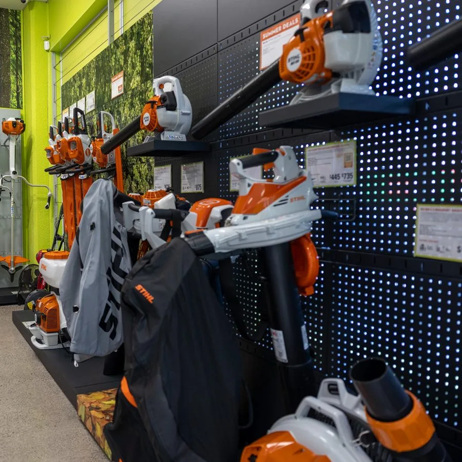A STIHL blower displayed on the showroom wall