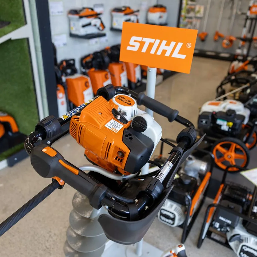 STIHL chainsaws and an earth auger on display in the showroom