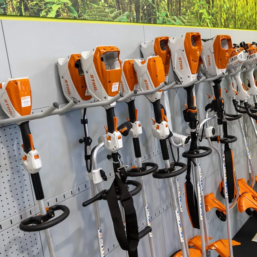 STIHL line trimmers hanging on the showroom display wall