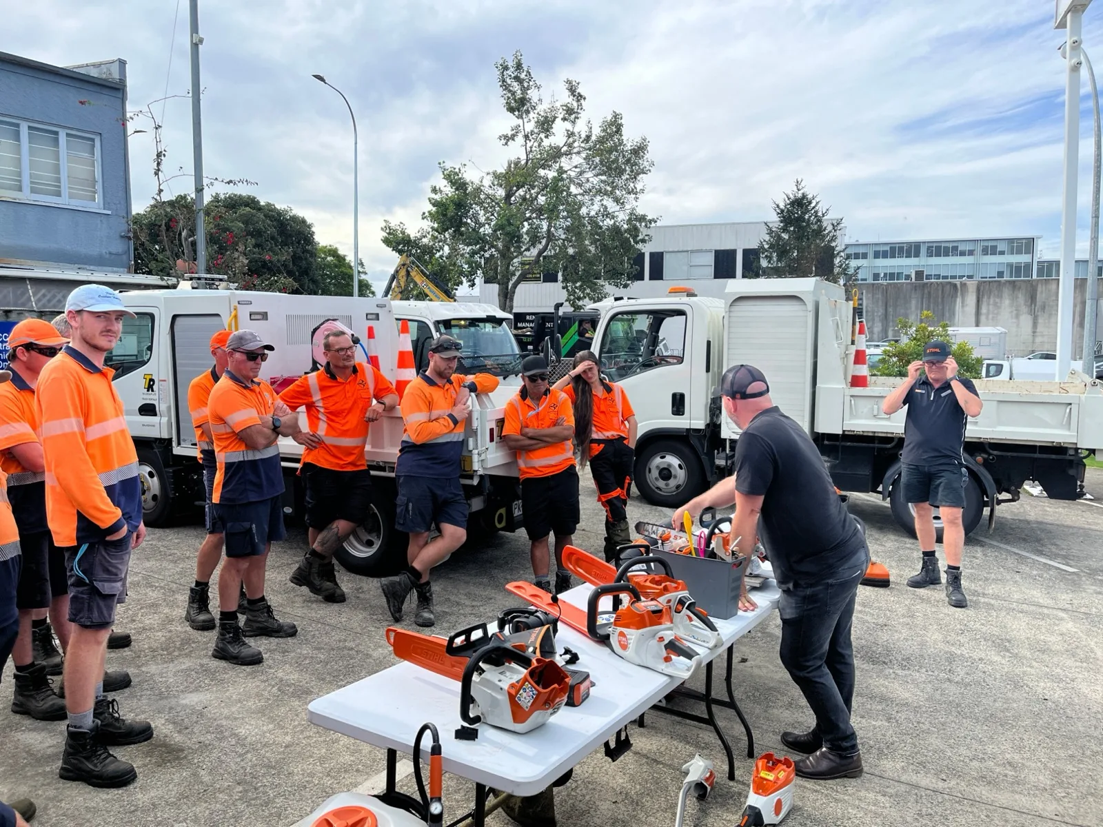 A STIHL SHOP Mt Maunganui team member running a toolbox talk on STIHL battery and petrol tools for the Tauranga City Council team in hi-vis